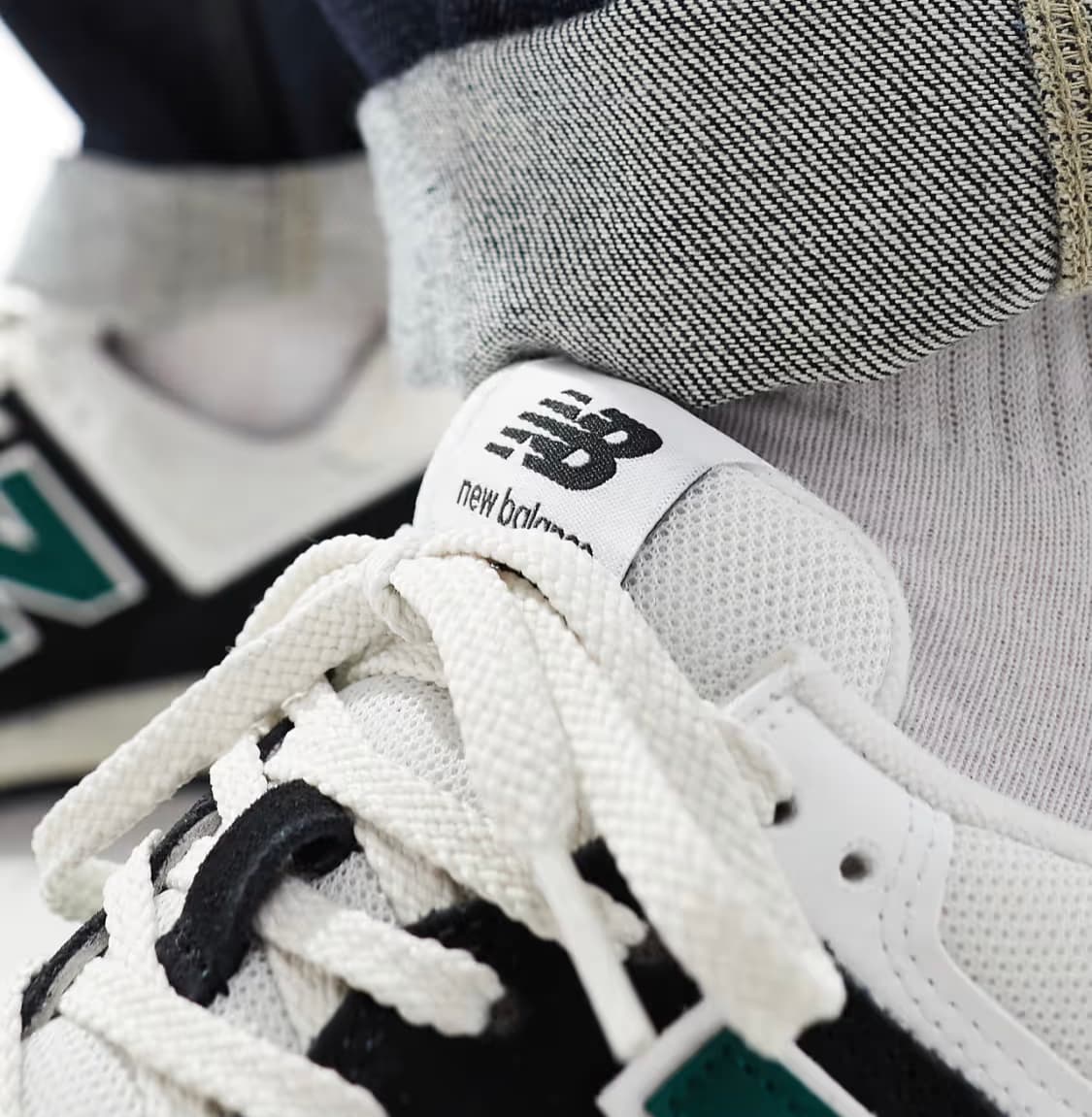 New Balance 574 trainers in black and green — image 3 of 3
